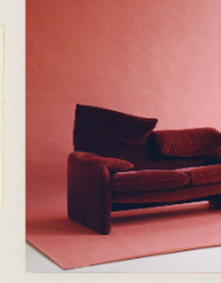 Editorial fashion shoot — terracotta backdrop, velvet sofa